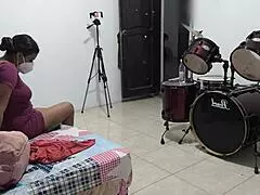 Sexy venezuelan housewife prepares her backpack for a holiday trip