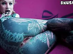 Tattoo girl stretches her asshole in solo anal play