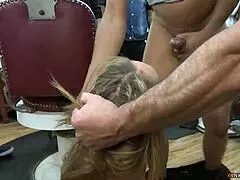 Blonde experiences intense anal pleasure in a public barbershop
