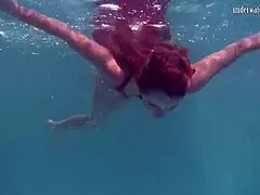 redhead b nikita vodorezova gets naked fast underwater