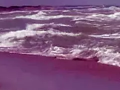 Gorgeous teen Agnes casually bathes her naked body in the ocean, showing big tits.