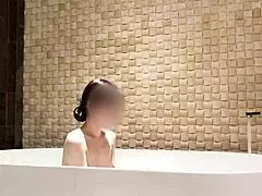 Bath time turns relaxing at a luxury hotel with stunning brunette vibes.