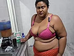 Stepmother gets intensely fucked in the kitchen by her stepson, receiving a massive cumshot.