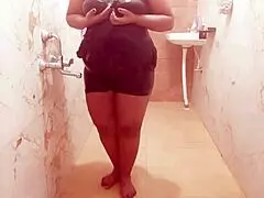 Descriptive view of a sexy Myanmar milf taking a relaxing shower, bathing her body