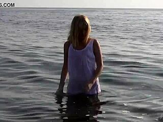 divine blonde teen strips naked by the sea, so hot!