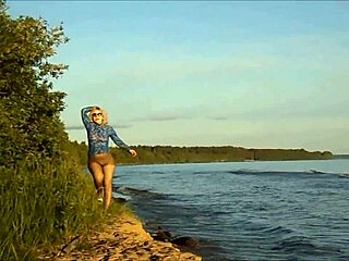 On a sunny beach, a crossdressing tease flashes no skirt and no panties in see-through pantyhose.