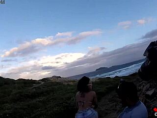 Novinha, are you sucking cock on the rocks by the sea?