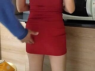 She tidies the kitchen, then enjoys a quick masturbation session.