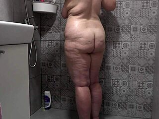 hidden camera catches a chubby mature wife in the shower with big tits and fat booty