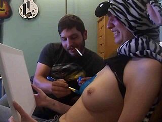 Redhead babe paints with natural tits