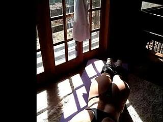 athletic latina teen works out in panties, showing big tits and ass to neighbor