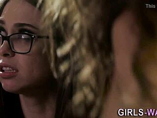 beautiful lesbian in glasses seduces a cute brunette with big tits for oral fun.