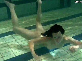Fresh teen dives into a steamy underwater public show