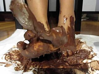 my feet with varnished nails all covered in chocolate cream, a goddess fetish delight