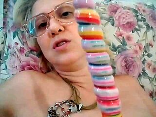 Blonde Milf Stella Still Sucks on a Delicious Lollipop with Intense Passion