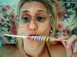 Blonde Milf Stella Still Sucks on a Delicious Lollipop with Intense Passion