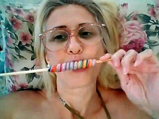 Blonde Milf Stella Still Sucks on a Delicious Lollipop with Intense Passion
