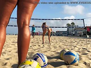 Hey, check this big booty African babe spiking on the beach!