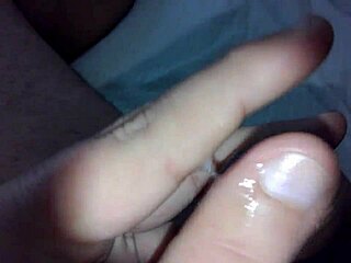 a gay guy is jerking off in his room, feeling all the pleasure and excitement