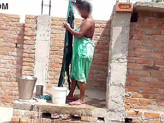 Sexy aunty bathes on her roof