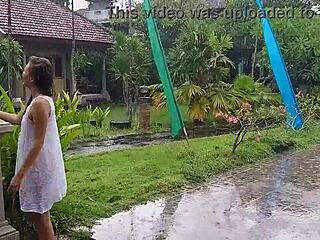 suggestive wet dress flashing in hotel bungalow yard close-up