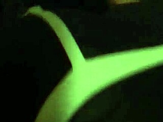 African woman poses in a bent over position for the camera.