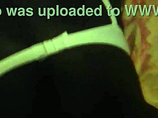 African woman poses in a bent over position for the camera.