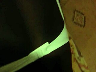 African woman poses in a bent over position for the camera.