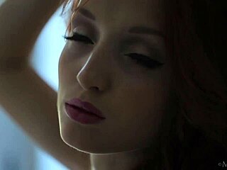 Feel the allure as redhead babe Michelle H sensually undresses in this solo scene.