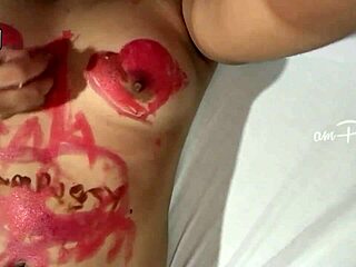 Amateur girl draws on naked Asian body with lipsticks