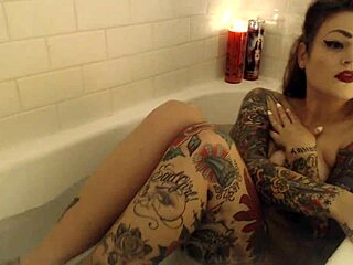 Tattooed beauty in the bath, what secrets does she hide?