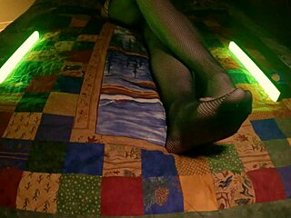 sensual housewife shows perfect feet in fishnet pantyhose