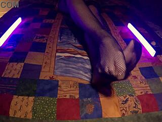 sensual housewife shows perfect feet in fishnet pantyhose