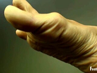 Jade Vixen removes her black hose, revealing wrinkled feet in nylon stockings