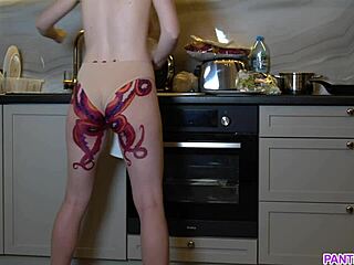 Naked housewife cooks with tattoo