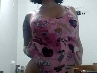 Mature woman dances seductively with big tits and ass