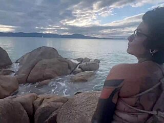 Anomaly Dark in shibari bondage with small tits exposed