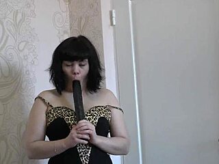 amateur in green pantyhose masturbates pussy with big black dildo toy