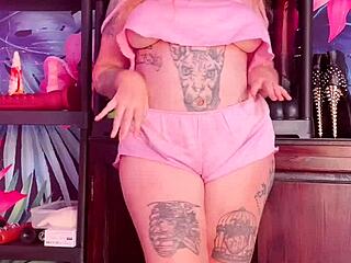 Curvy woman teases in silk pajamas.