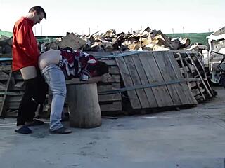 Fucking on a log outdoors.