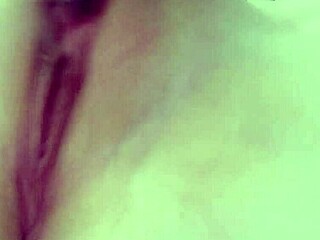 wife fingers her pussy while masturbating