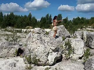 Mature Woman Dances Topless in White Stone Quarry
