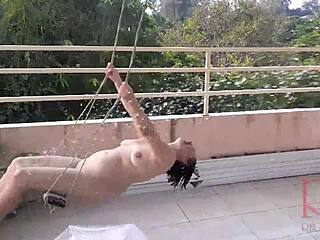 depraved housewife swings without panties, hiding from rain under an umbrella in full video.