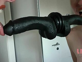 Blonde deepthroats dildo making her shaved pussy wet with toys