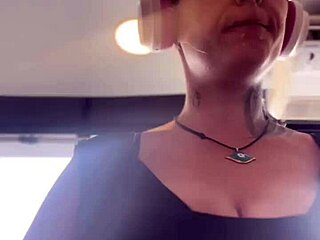 blonde with big tits trains at the gym, sweats heavily, sits to expose her breasts and breathe.