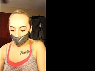 Blonde slut bound and gagged in homemade tape.