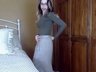 beautiful woman in glasses slowly undresses before getting bent over for action