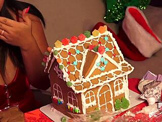 making gingerbread house with friends at christmas