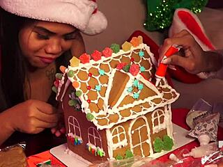 making gingerbread house with friends at christmas
