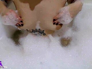 cute babe sloppy sucks huge dildo in foamy bath